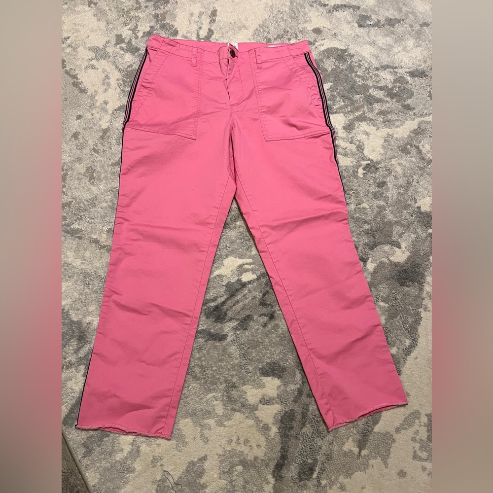 Pink trousers with a navy blue side stripe.